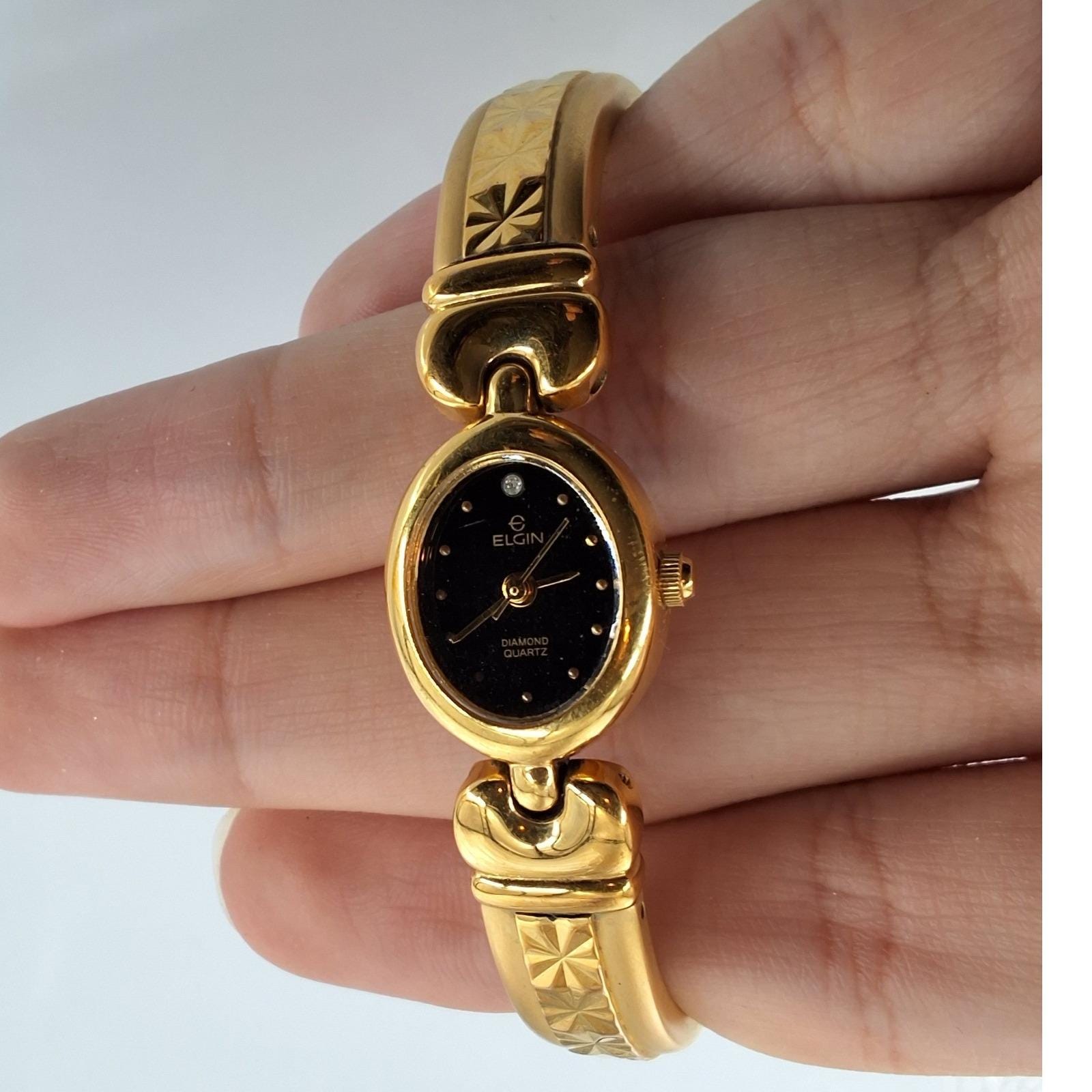 Vintage Elgin Gold Tone Oval Black Dial Diamond Accent Bangle Watch