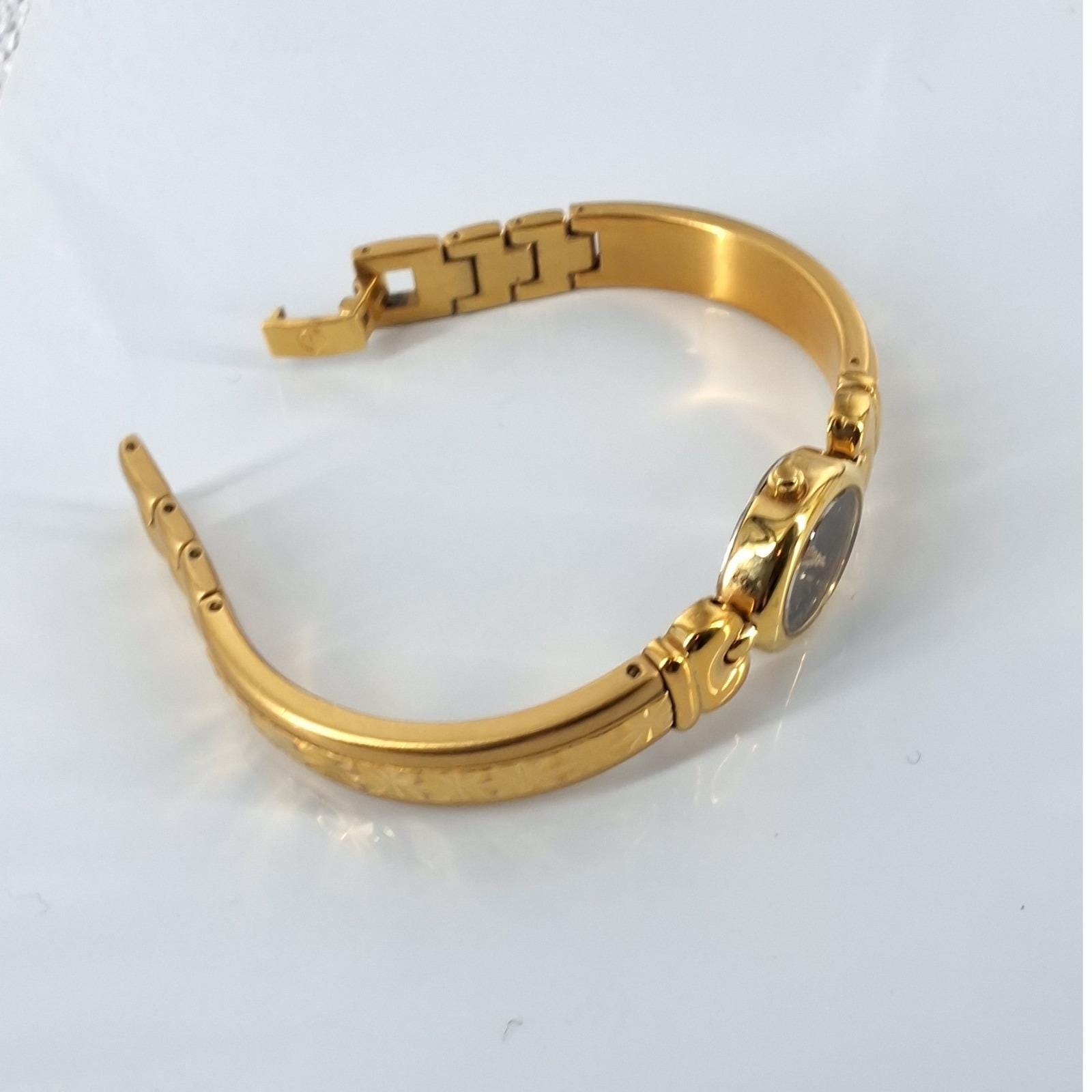 Vintage Elgin Gold Tone Oval Black Dial Diamond Accent Bangle Watch - View 4
