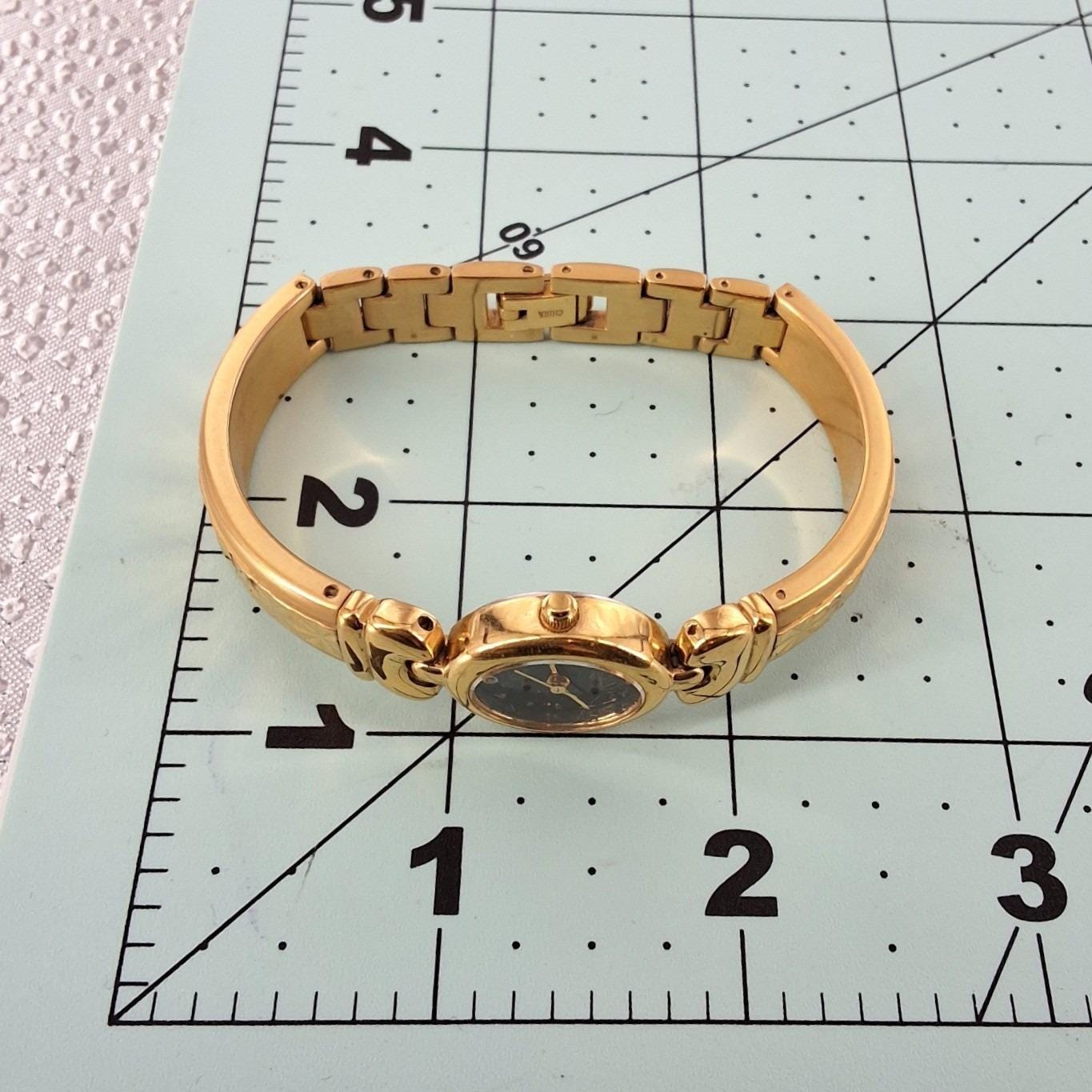 Vintage Elgin Gold Tone Oval Black Dial Diamond Accent Bangle Watch - View 6